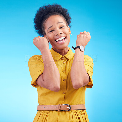 Buy stock photo Celebration, fist and happy black woman in studio for news, deal or success on blue background. Wow, hand and excited lady winner smile for sale, discount or coming soon promo, announcement or deal