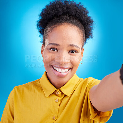 Buy stock photo Happy woman, face and portrait smile for selfie, photography or memory against a blue studio background. African female person or photographer smiling for picture, photo or online social media post