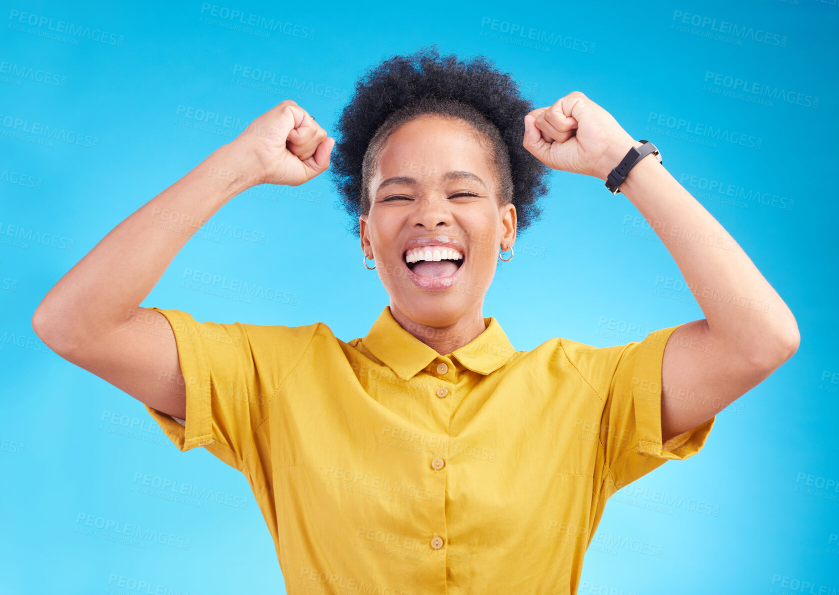 Buy stock photo Happy woman, fist pump and celebration for winning, promotion or bonus against a blue studio background. African female person enjoying victory, sale or discount in happiness for achievement or goals