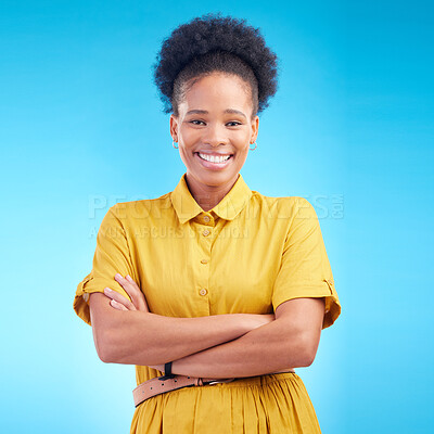 Buy stock photo Black woman, portrait and happy in studio with a smile, confidence and a positive mindset. Fashion, arms crossed and African female model person in casual clothes on a blue background for motivation