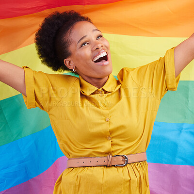 Buy stock photo Pride, flag and happy black woman in studio for gay, rights and lgbtq life  or choice. Rainbow, freedom and lesbian African female celebrating, smile and confident with inclusion and support