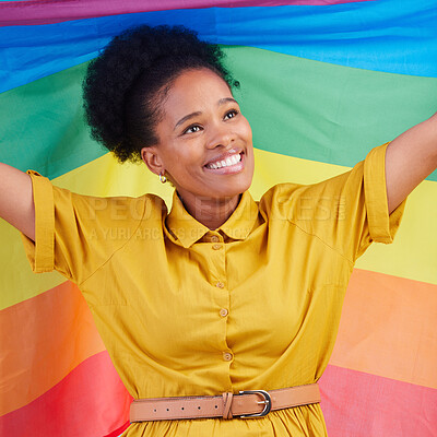 Buy stock photo Gay, flag and happy black woman in studio for pride, rights and lgbtq lifestyle choice. Rainbow, freedom and face of lesbian African female smile, free and confident with queer sexuality or identity 