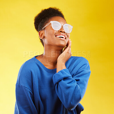 Buy stock photo Happy, laugh and glasses with face of black woman in studio for vision, eye care and trendy style. Gen z, smile and happiness with creative female person on yellow background for pride and health