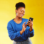 Happy black woman, phone and social media for networking or communication against a yellow studio background. African female person smile for online browsing or chatting on mobile smartphone app