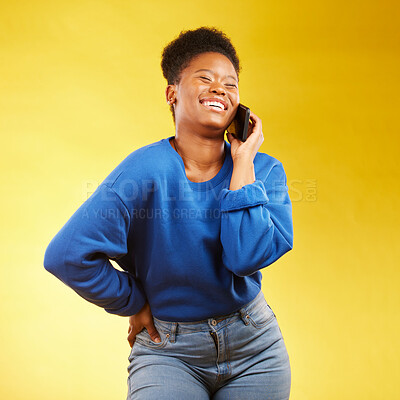 Buy stock photo Phone call, laugh and black woman in studio happy, silly or share joke on yellow background. Funny, talking and African lady with goofy, gossip or conversation on smartphone for online communication 