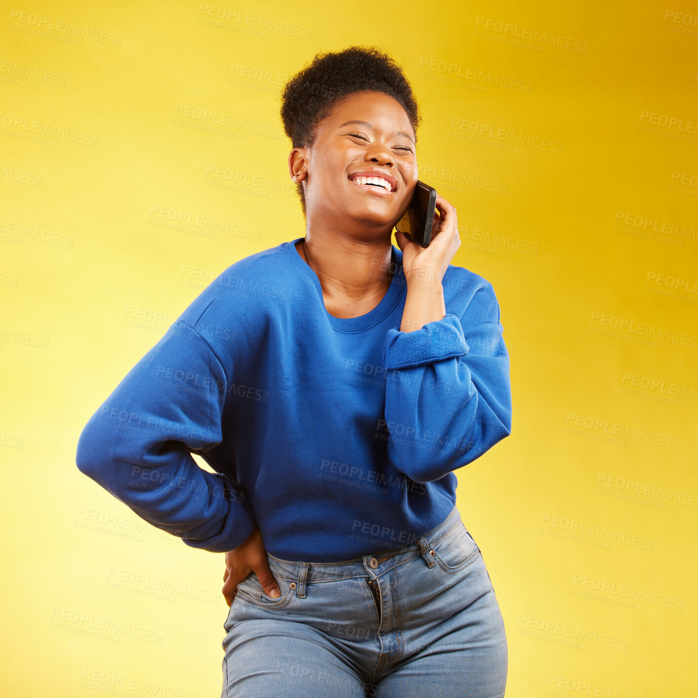Buy stock photo Phone call, laugh and black woman in studio happy, silly or share joke on yellow background. Funny, talking and African lady with goofy, gossip or conversation on smartphone for online communication 