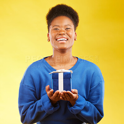 Buy stock photo Gift, birthday and portrait of black woman with a surprise happy isolated in a yellow studio background with a present. Winning, box and excited person to celebrate, party and holiday as a winner
