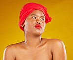 Beauty, makeup and cosmetics with face of black woman in studio for head scarf, creative and pride. Skincare, salon and natural with female model on brown background for wellness, self care and glow