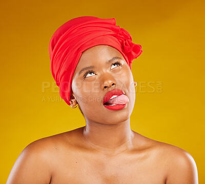 Buy stock photo Tongue, fashion and a black woman with makeup on a studio background for beauty and comedy. Idea, playful and a funny face of African girl or model with a headscarf, cosmetics and funny on a backdrop