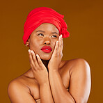 Woman, face and hair scarf with skincare beauty, makeup and haircare in studio. Brown background, African female person and cosmetics of a model with head wrap for culture with dermatology glow