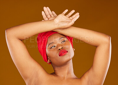 Buy stock photo Beauty, makeup and headscarf with face of black woman in studio for facial, creative and pride. Skincare, salon and natural with female model on brown background for wellness, self care and glow