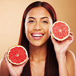 Grapefruit, beauty and portrait of a woman with skin care in studio for dermatology and cosmetics. Natural facial, fruit and healthy diet for detox or vitamin c of a person on a brown background 