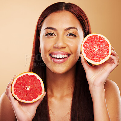 Buy stock photo Grapefruit, beauty and portrait of a woman with skin care in studio for dermatology and cosmetics. Natural facial, fruit and healthy diet for detox or vitamin c of a person on a brown background 