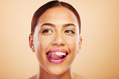 Buy stock photo Lick, teeth or happy woman with tongue, smile or thinking of dental wellness against a studio background. Person, mouth or girl model with teeth whitening for oral health, tooth cleaning or beauty 