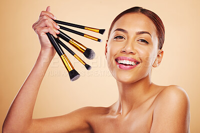 Buy stock photo Makeup, brush and woman with cosmetic beauty product application for skincare isolated in a studio brown background. Happy, elegant and powder for cosmetology aesthetic, glow and soft skin glamour