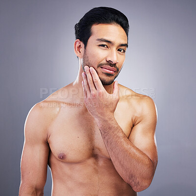 Buy stock photo Portrait, skincare and man with muscle body, cosmetics and dermatology on a grey studio background. Face, male person or model with self care, beard treatment or facial with wellness, shine or health