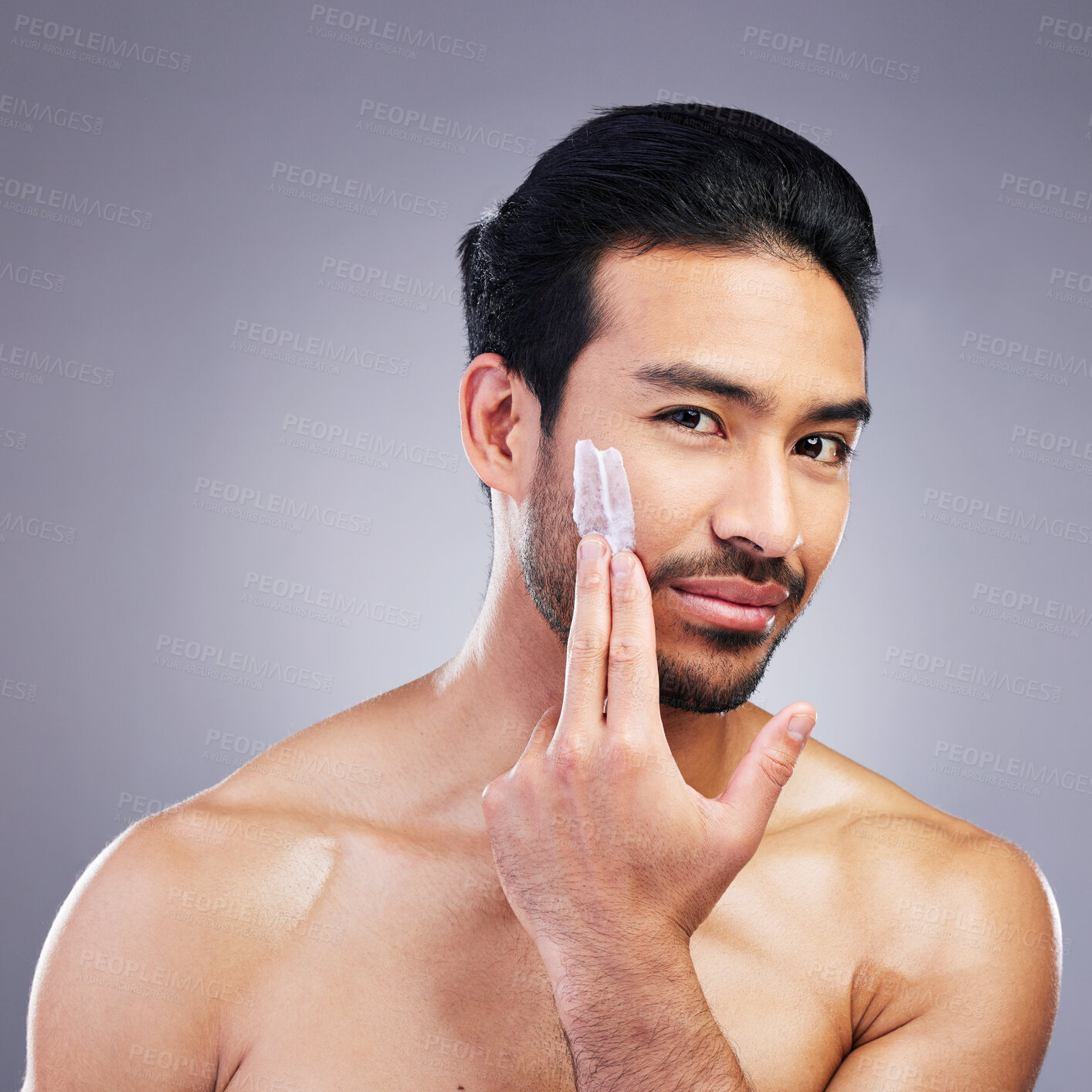 Buy stock photo Skincare portrait, cream and studio man with facial cleaning routine, morning hydration or spa self care. Bathroom cosmetics, face lotion product and aesthetic person wellness on gray background