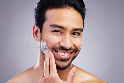 Buy stock photo Smile, portrait or happy man with shaving cream or beard product in grooming routine with cosmetics. Beauty, studio background or Asian male model applying hair removal creme lotion for skincare 