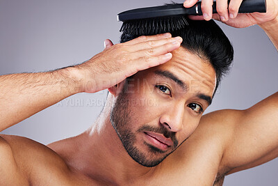 Buy stock photo Portrait, beauty or man brushing hair in grooming with salon haircare product on studio background. Natural person, brush or confident healthy Asian male model with cool hairstyle in morning routine