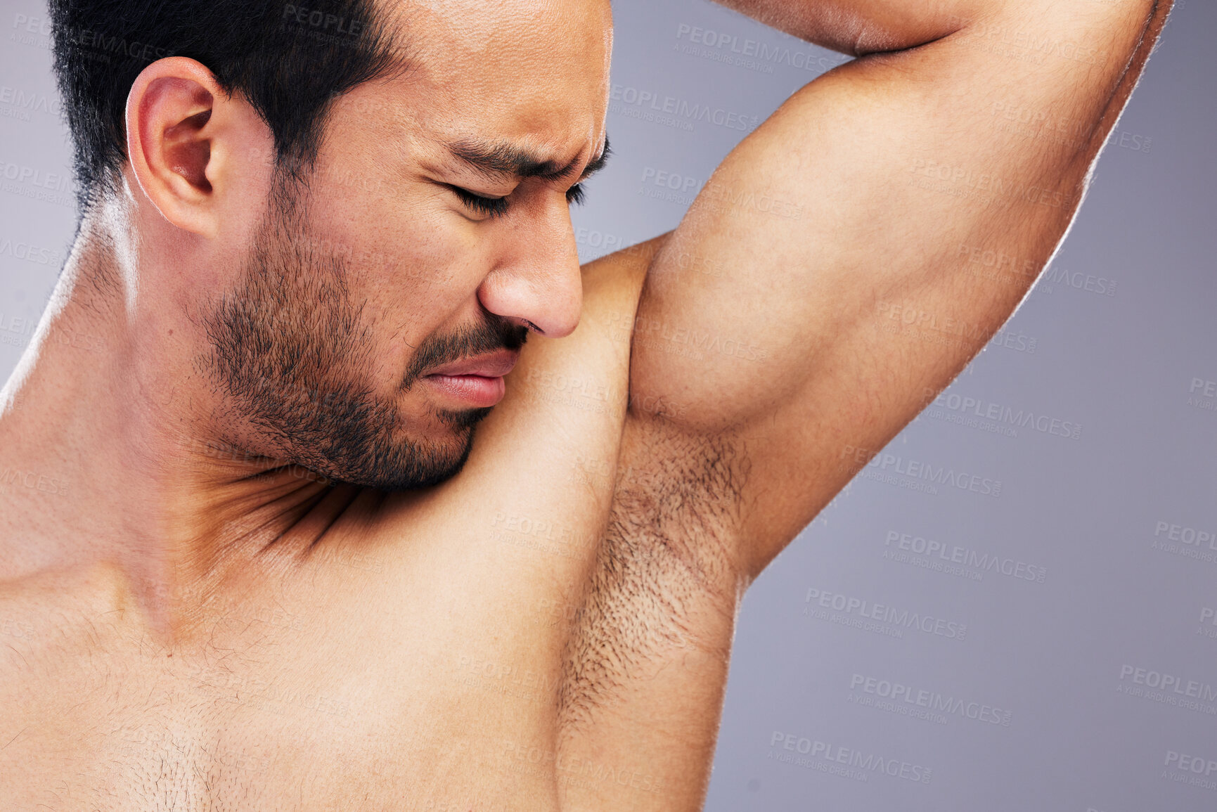 Buy stock photo Armpit, stink and man with body odor in studio isolated on a white background for deodorant, cleaning and skincare cosmetic. Underarm, bad smell and model with hyperhidrosis, sweating or poor hygiene