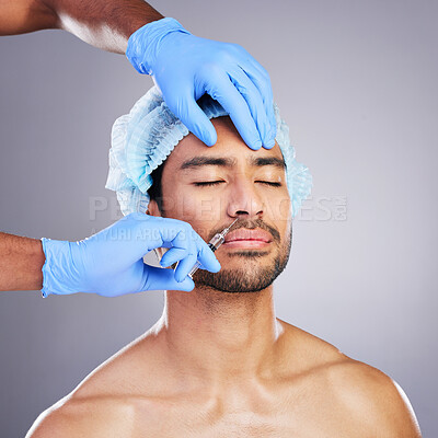 Buy stock photo Hands, face and change with a man in studio on a gray background for a silicon injection. Beauty, plastic surgery or transformation with a male customer in a clinic for antiaging filler and cosmetics