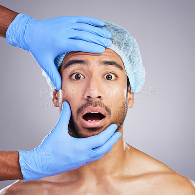 Buy stock photo Man, hands and face for plastic surgery in studio with fear, pain and scared for cosmetics by background. Doctor gloves, dermatology surgeon and patient with wow, surprise and facial transformation