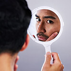 Plastic surgery, mirror and face drawing with studio and man with check for needle and syringe placement. Skincare, filler and dermatology of a male person with medical procedure and collagen process