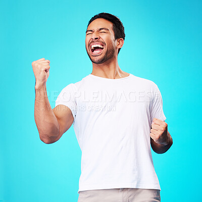 Buy stock photo Happy asian man, winner and fist in studio for celebration, achievement and success on blue background. Excited model shout to celebrate winning prize, deal and victory of lottery, reward and bonus 