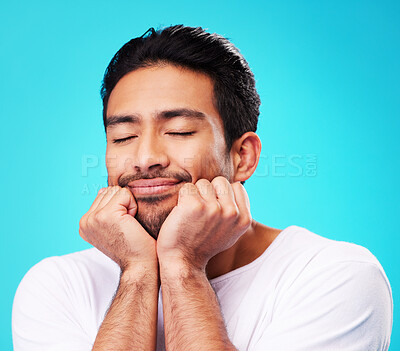 Buy stock photo Sleeping, dreaming and man face in studio with memory, relax smile and thinking to remember. Isolated, blue background and happy Indian male model with eyes closed for rest and nap feeling thoughtful