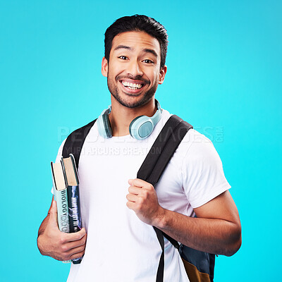Buy stock photo Indian, college student and portrait in studio with backpack for university, education and studying with books on blue background. Happy, man and person excited to study and learn for future goals