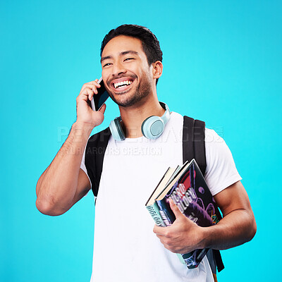 Buy stock photo Talking, phone and college student in studio with backpack for university, education and studying books on blue background. Happy, man and person excited for learning and mobile network connection