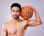 Portrait, basketball and body with a sports man in studio on a gray background for training or a game. Fitness, muscle or mindset and a shirtless young male athlete holding a ball with focus