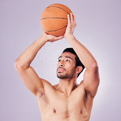 Buy stock photo Fitness, basketball and a sports asian man shooting in studio on a gray background for training or a game. Exercise, body or aim and a shirtless young male athlete holding a ball during a competition