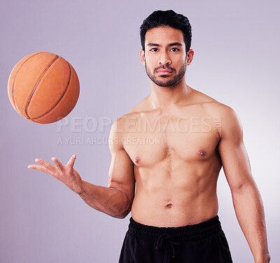 Buy stock photo Portrait, sports and basketball with a man in studio on a gray background for training or a game. Exercise, workout or mindset and a confident young male athlete with a ball for a competitive hobby