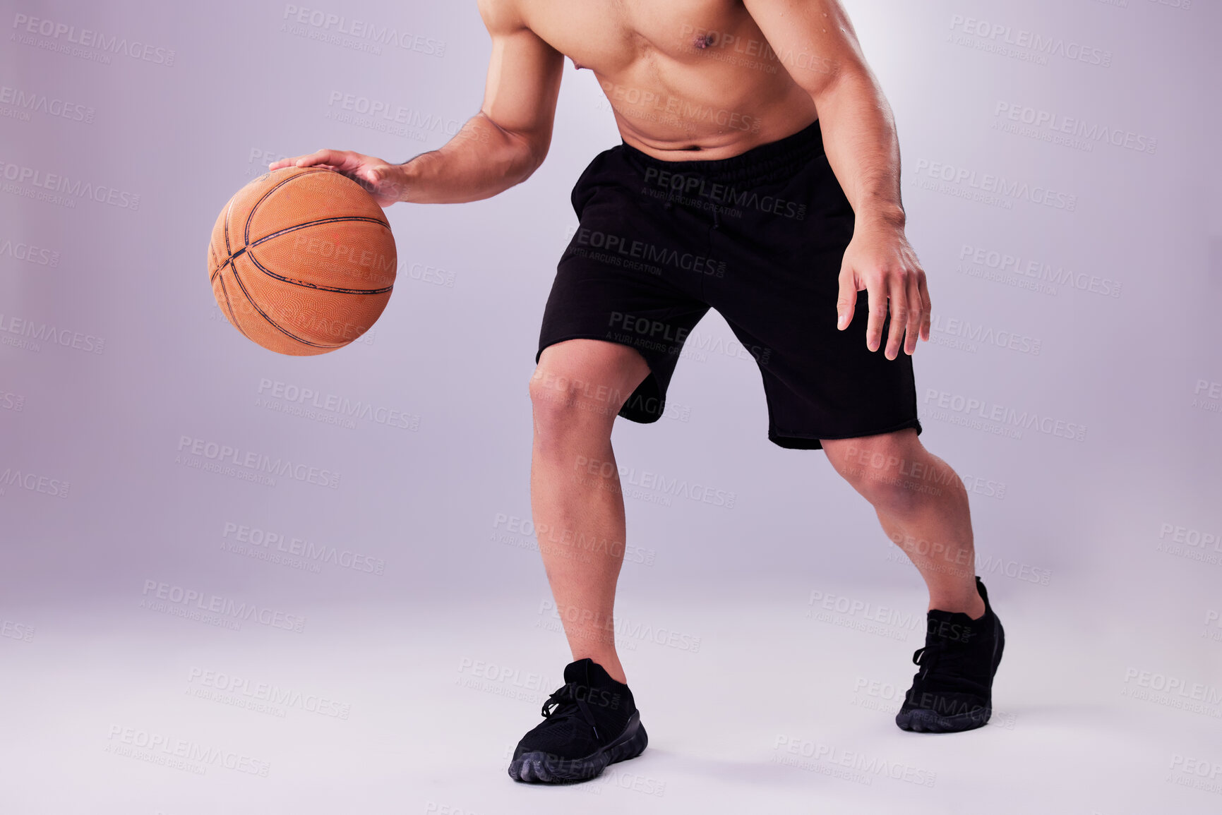 Buy stock photo Fitness, basketball and bounce with a sports man in studio on a gray background for training or a game. Exercise, workout or dribble and healthy body of shirtless male athlete playing ball with skill