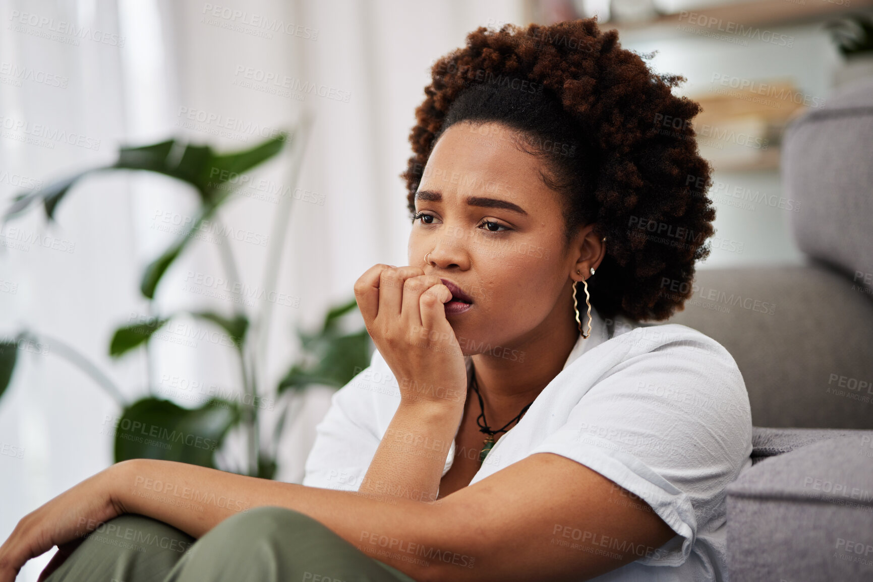 Buy stock photo Depressed, sad and african girl in home with anxiety for future with upset expression. Worry concern and remembering with female person in living on floor with problems or mental health with memory.