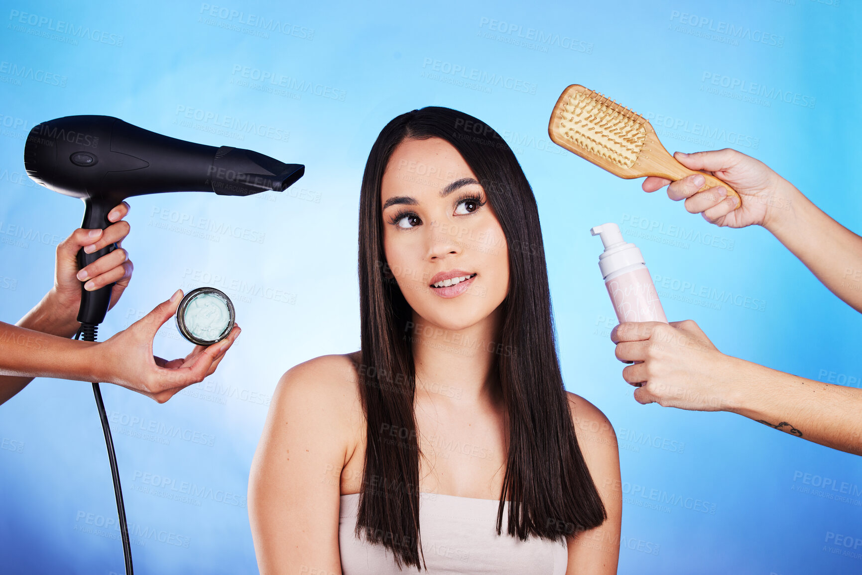 Buy stock photo Hair care, beauty and tools with a woman in studio with a hairdryer, self care product and brush. Salon, hairdresser and a female model person thinking of shampoo and cosmetics on a blue background