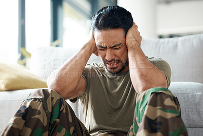 Buy stock photo Soldier, man and stress, headache or PTSD of military trauma, remember pain and fear or scared on floor. Sad, frustrated and mental health of army or veteran person with depression or anxiety at home