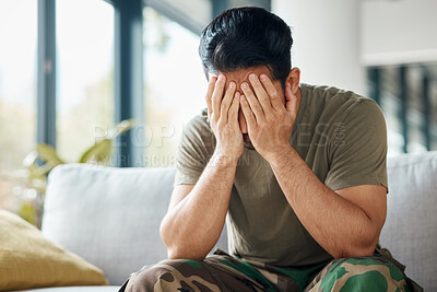 Buy stock photo Military, army and a man with trauma and depression while sitting on a sofa with mental health or stress. Soldier, psychology and a male person with anxiety, fear and frustration or ptsd crisis