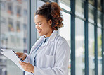 Woman, doctor and reading healthcare documents for hospital administration, research paper and review. Happy black female medical worker planning checklist of insurance report, test results or script