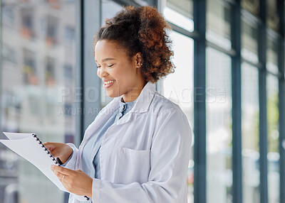 Buy stock photo Woman, doctor and reading healthcare documents for hospital administration, research paper and review. Happy black female medical worker planning checklist of insurance report, test results or script