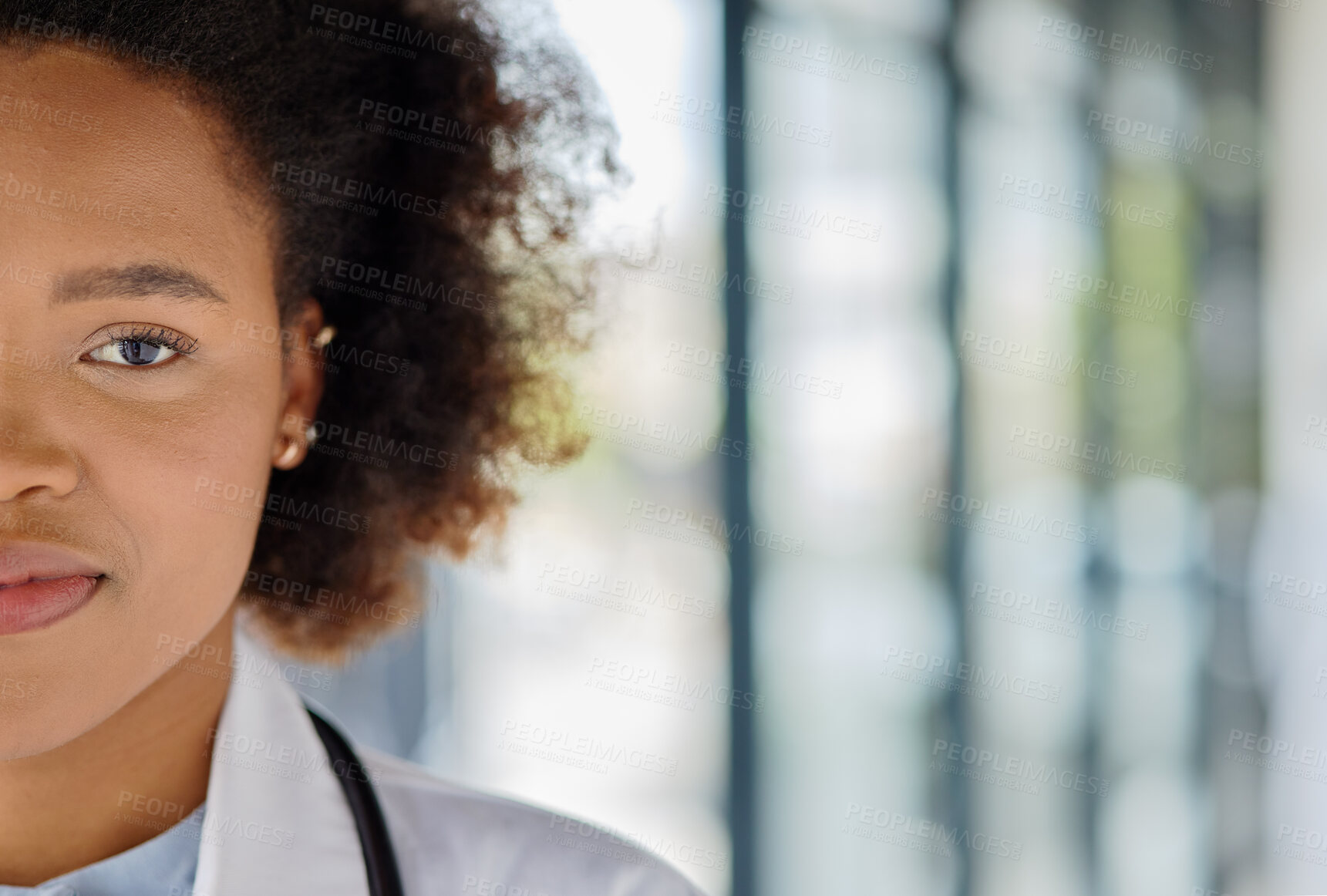 Buy stock photo Portrait, half face and a black woman or doctor at a hospital with mockup for advertising. Healthcare, medicine and a young African nurse or surgeon with space for marketing at a clinic with bokeh