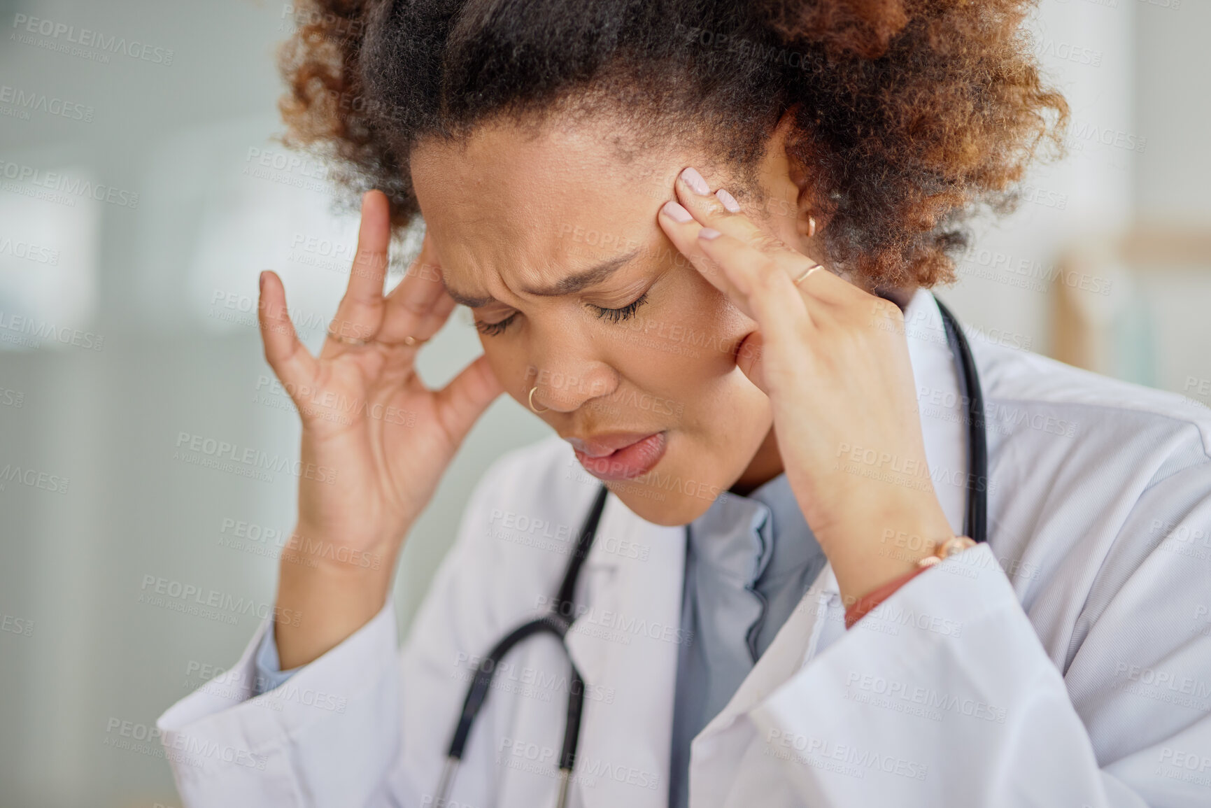 Buy stock photo Headache, tired doctor and black woman in hospital with burnout, clinic problem and challenge of stress. Face of frustrated female healthcare worker with fatigue, migraine pain and anxiety of mistake