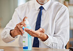 Hands, bottle and sanitizer for business man, cleaning and stop virus for health, wellness or hygiene in office. Professional person, entrepreneur or employee with product, gel or liquid for bacteria