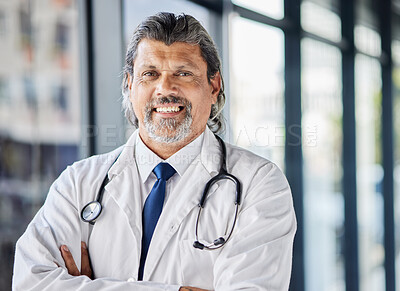 Doctor, healthcare portrait and arms crossed in clinic or hospital of patient support, leadership or management. Face of senior medical person for professional service, health insurance and proud job