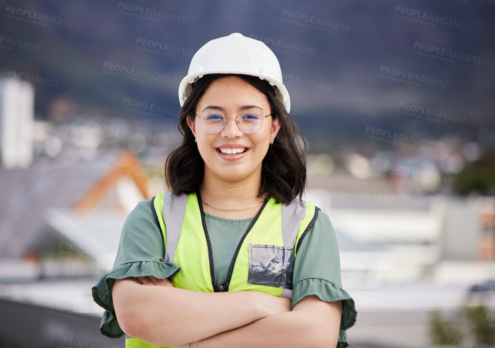 Buy stock photo Engineering, crossed arms and portrait of a female construction worker on a building rooftop. Confidence, industry and woman industrial manager for maintenance, renovation or inspection in the city.