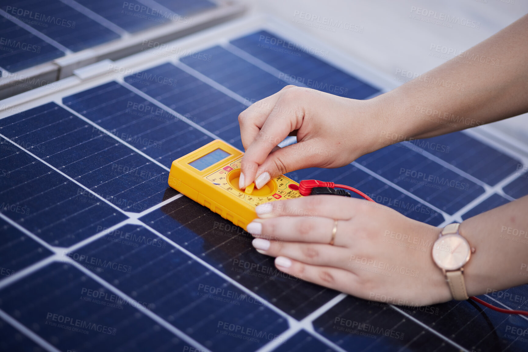 Buy stock photo Solar panels, voltage meter and hands for renewable energy, electricity or innovation. Closeup, charge and a person with gear for sustainable lighting, grid or photovoltaic tools for a home generator