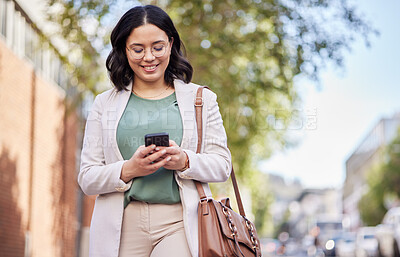 Buy stock photo Phone, city and happy business woman for outdoor communication, networking and social media. Chat, typing and mobile search of young professional person walking and travel in urban street for contact