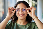 Woman, glasses and portrait with smile, optometry and health with eyes, choice and fashion in store. Girl, frame and lens for wellness, vision and shop for eyesight, decision and customer experience