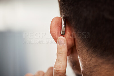 Buy stock photo Closeup of ear, hearing aid and man with disability from the back for support, improve listening or amplifier with mockup space. Deaf patient, face and audiology implant to help volume of sound waves